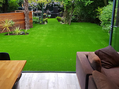 Synthetic grass installation on a backyard in Kingston