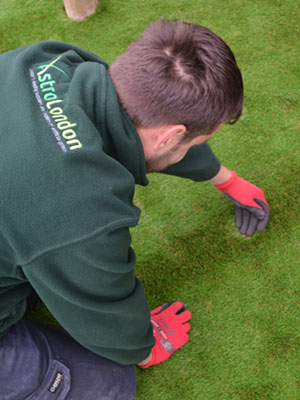 Astrolondon team inspecting artificial grass